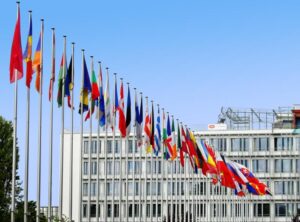 A row of flags of different nationalities.